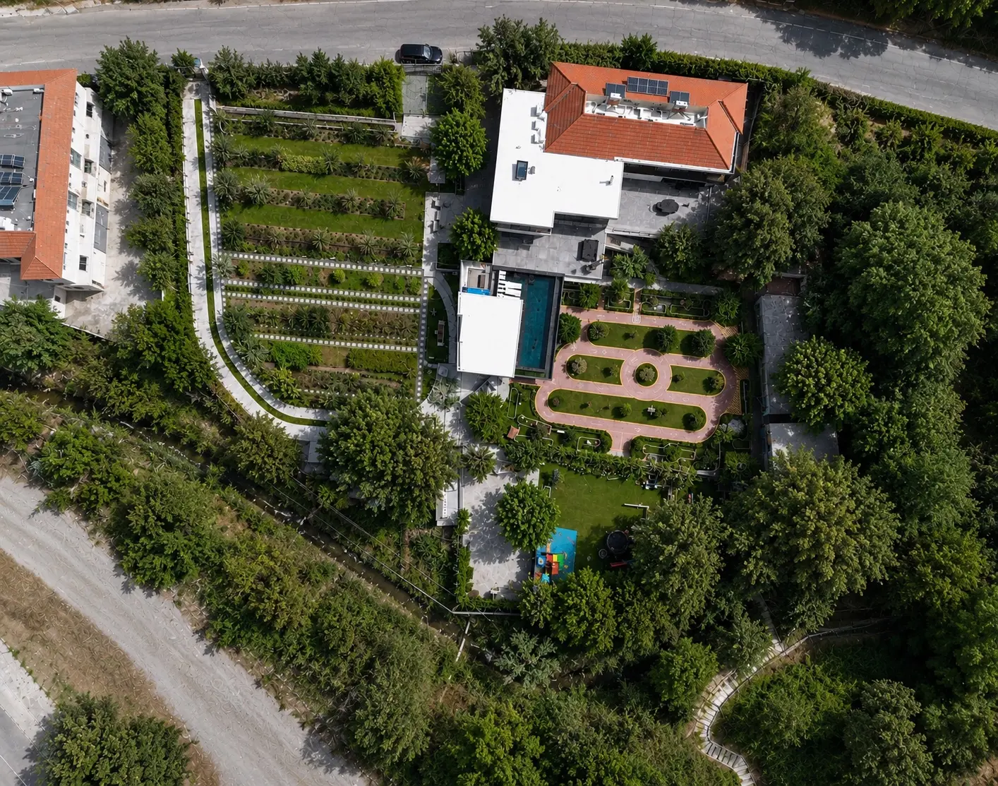 Aerial view of Mnasos Villa, its pool and landscaped grounds in Limassol