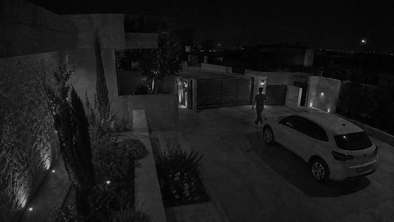 Illustrative conventional low-light rendering of the villa entrance